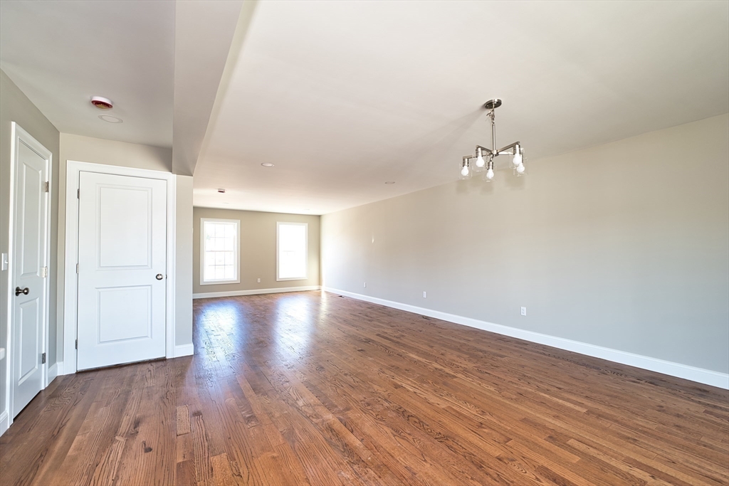 124 Downing Street Fall River, MA 02723 - Photo 10 of 33 a view of empty room with wooden floor and fan