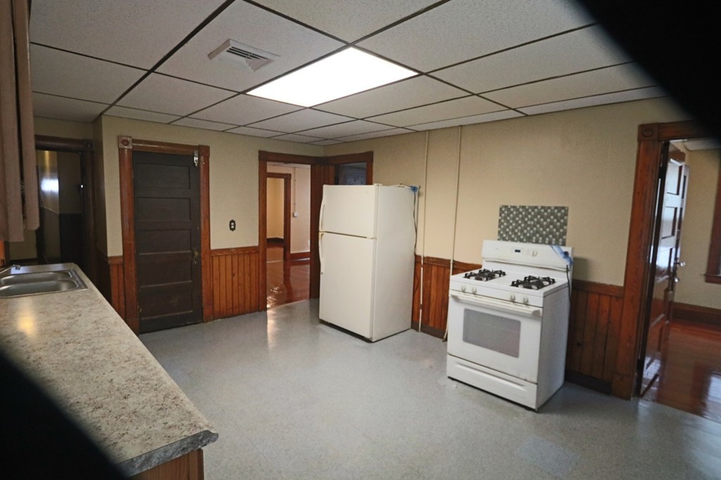 276-278 Centre Street Springfield, MA 01151 - Photo 14 of 21 a view of kitchen with furniture and refrigerator