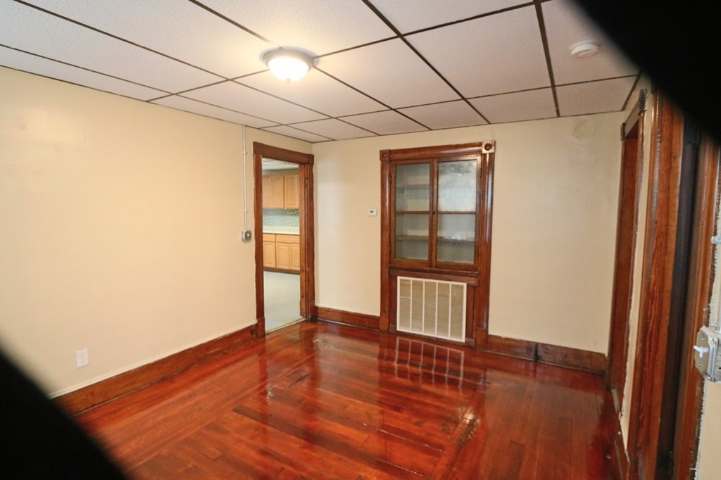 276-278 Centre Street Springfield, MA 01151 - Photo 16 of 21 an empty room with wooden floor and windows