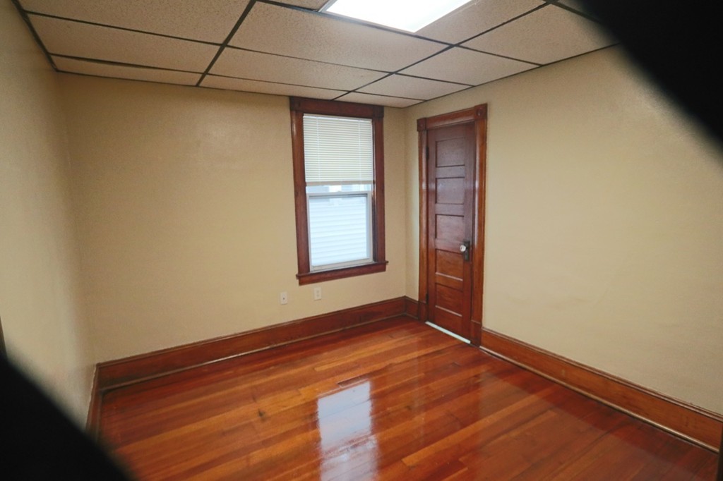 276-278 Centre Street Springfield, MA 01151 - Photo 19 of 21 a view of room with window and wooden floor