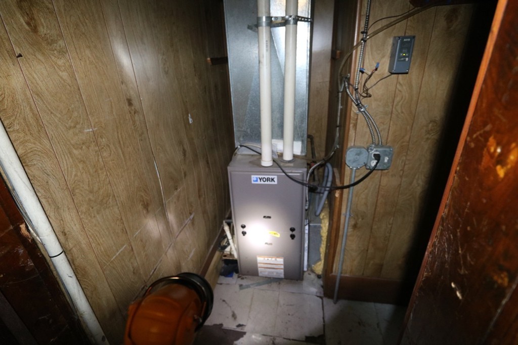 276-278 Centre Street Springfield, MA 01151 - Photo 10 of 21 a bathroom with a sink a toilet and shower curtain