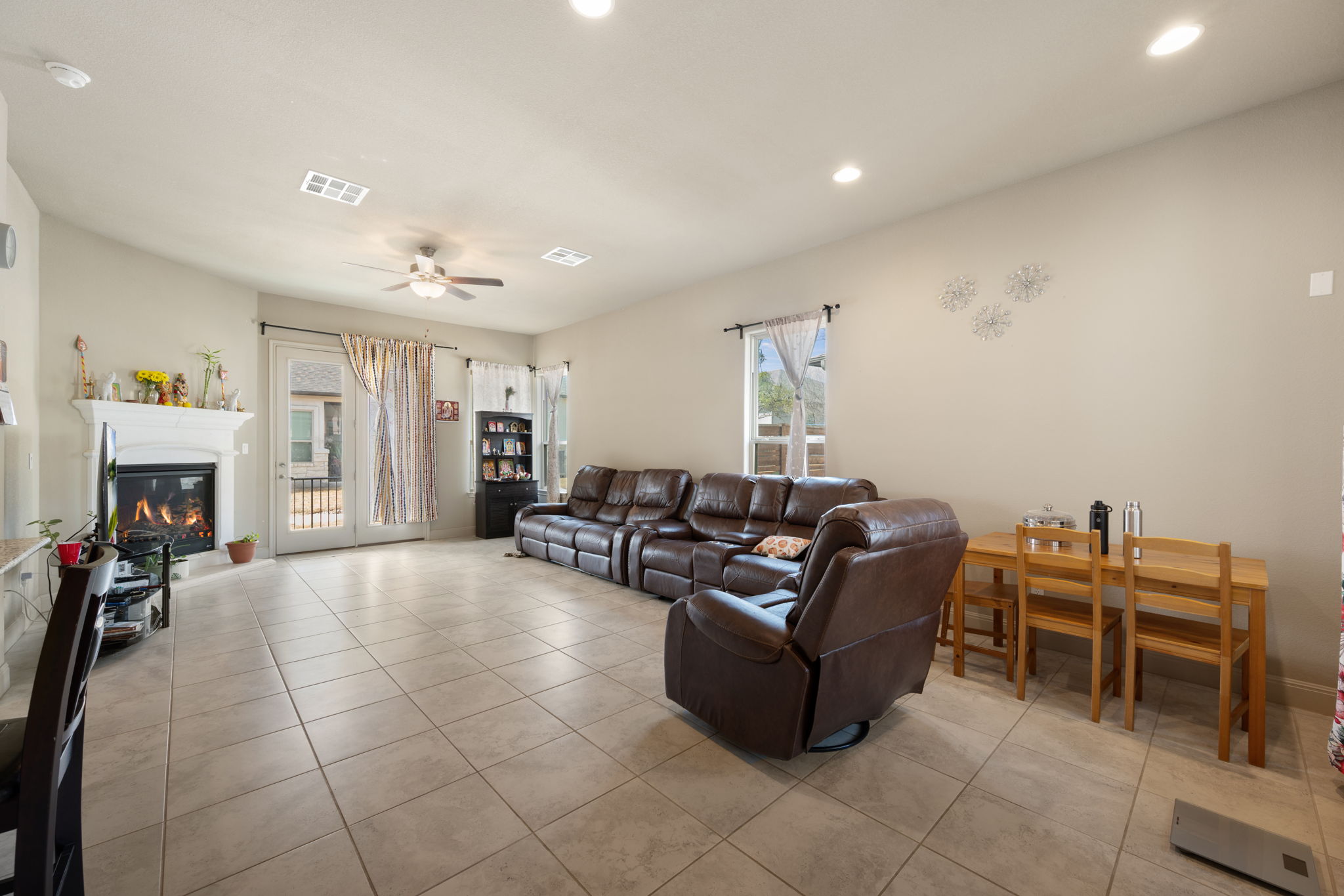 205 Clubhouse Drive, Unit G Georgetown, TX 78628 - Photo 2 of 40 a living room with furniture and a fireplace
