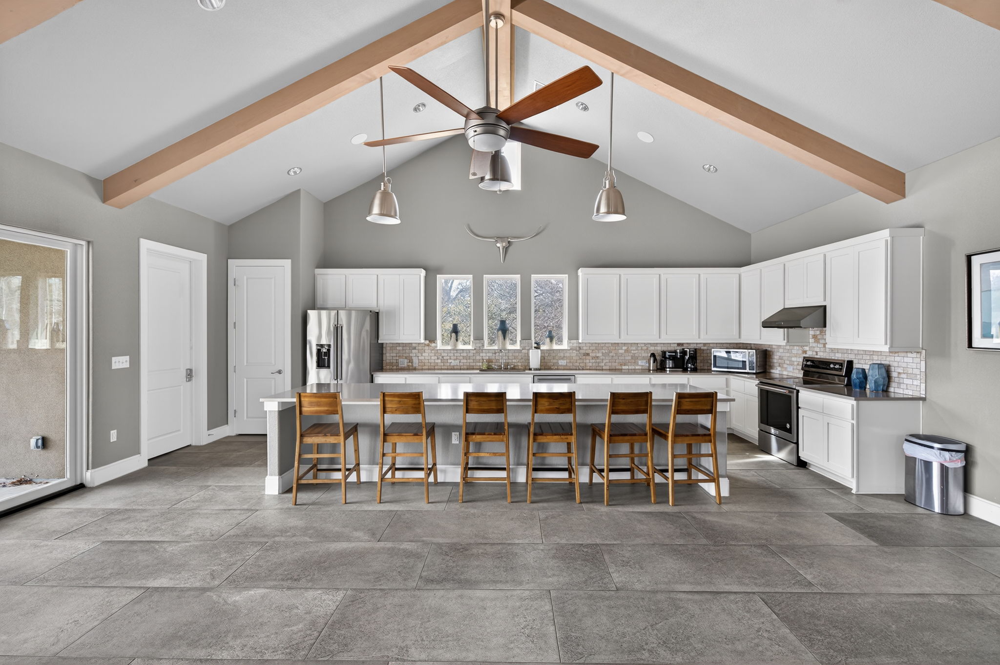 205 Clubhouse Drive, Unit G Georgetown, TX 78628 - Photo 35 of 40 a large kitchen with a table and chairs in it