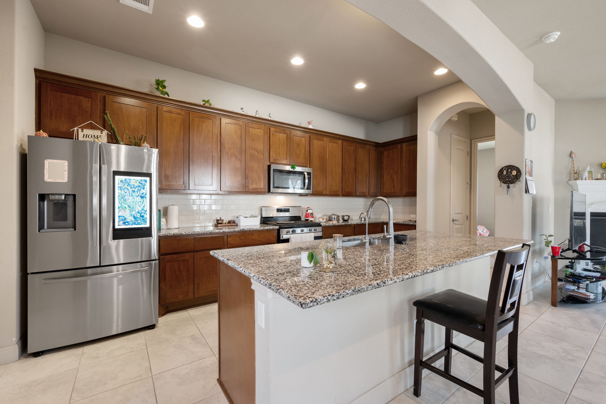 205 Clubhouse Drive, Unit G Georgetown, TX 78628 - Photo 7 of 40 a kitchen with refrigerator cabinets and a counter top space