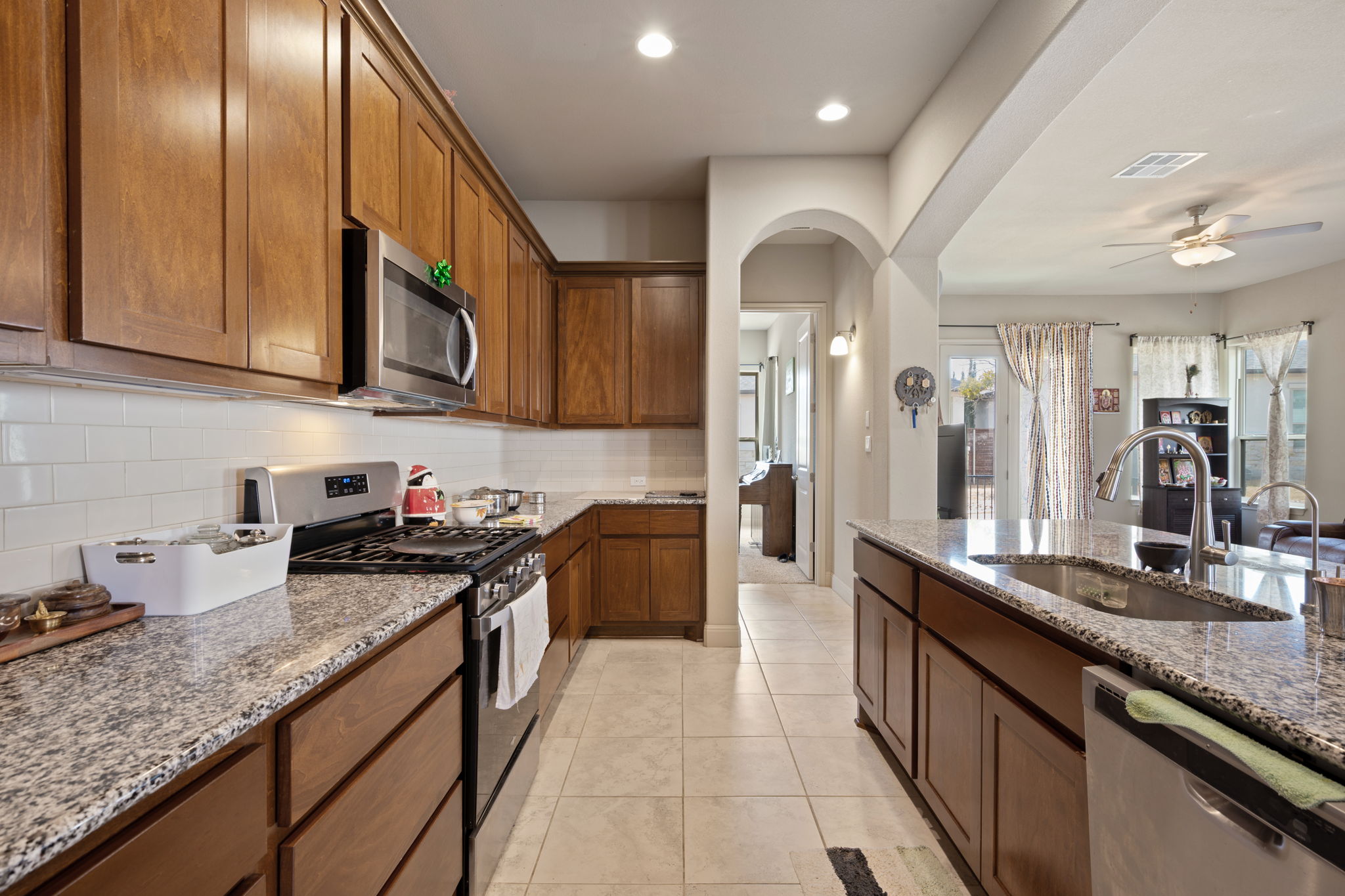 205 Clubhouse Drive, Unit G Georgetown, TX 78628 - Photo 8 of 40 a kitchen with stainless steel appliances granite countertop a sink stove and cabinets