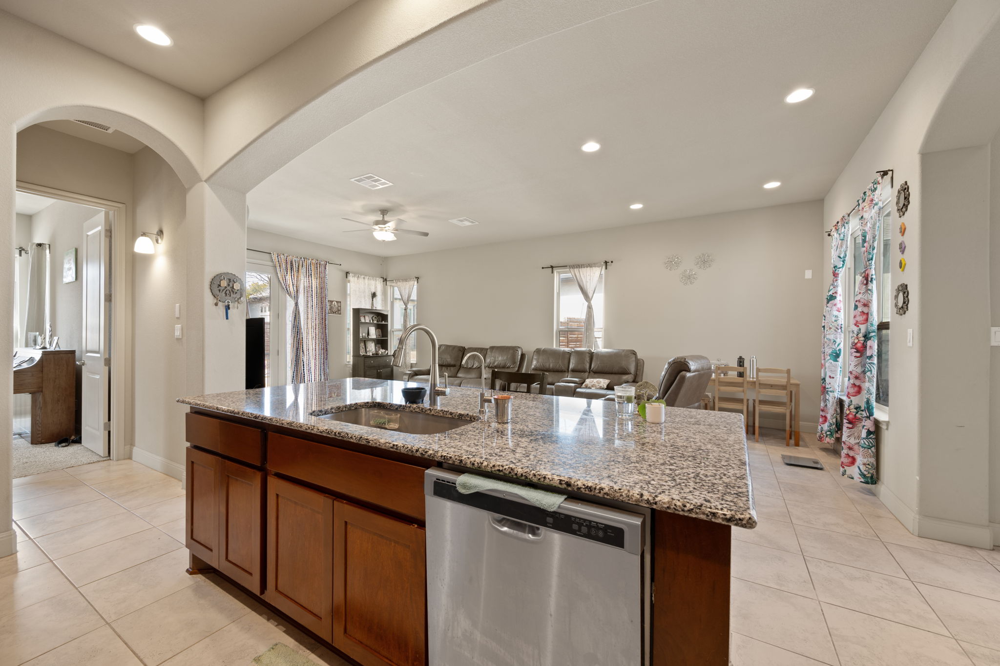 205 Clubhouse Drive, Unit G Georgetown, TX 78628 - Photo 10 of 40 a kitchen with stainless steel appliances granite countertop a sink and a refrigerator