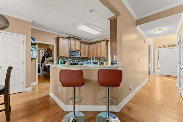 a view of a dining room with furniture window and wooden floor