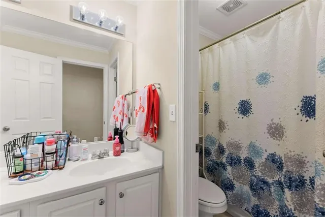 a spacious bedroom with a bed couch and a window