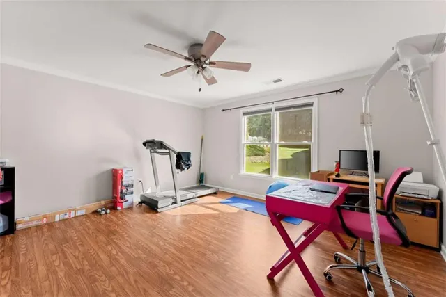 a view of a roof deck with wooden floor and roof with a potted plant