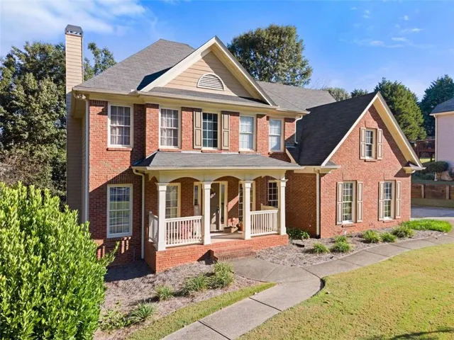 front view of a house with a yard