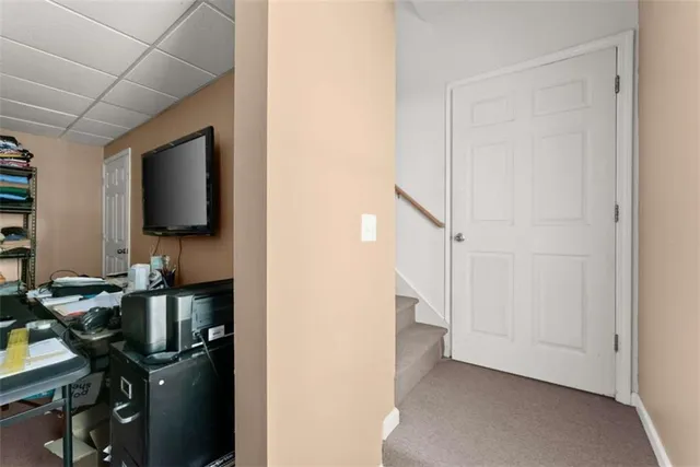 an aerial view of a houses with yard