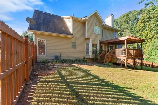 an aerial view of residential building with green space