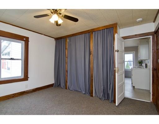 57 Denver Street Springfield, MA 01109 - Photo 14 of 30 a view of a livingroom with a ceiling fan and window