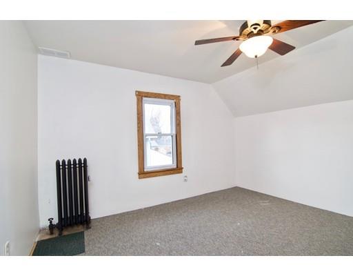 57 Denver Street Springfield, MA 01109 - Photo 20 of 30 an empty room with windows and fan