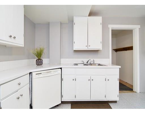 57 Denver Street Springfield, MA 01109 - Photo 3 of 30 a kitchen with white cabinets and sink