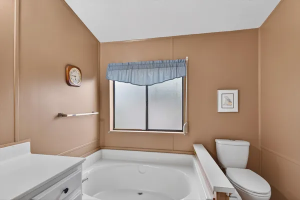 a bathroom with a toilet and a sink