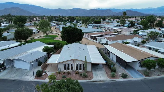 an aerial view of a house with a garden