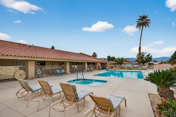 a view of house with patio outdoor seating yard