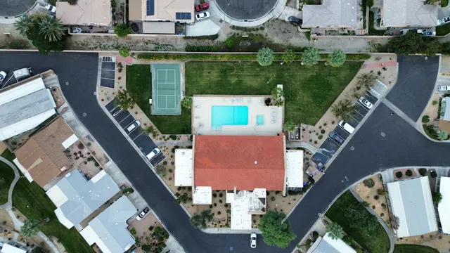 an aerial view of house with yard swimming pool and outdoor seating