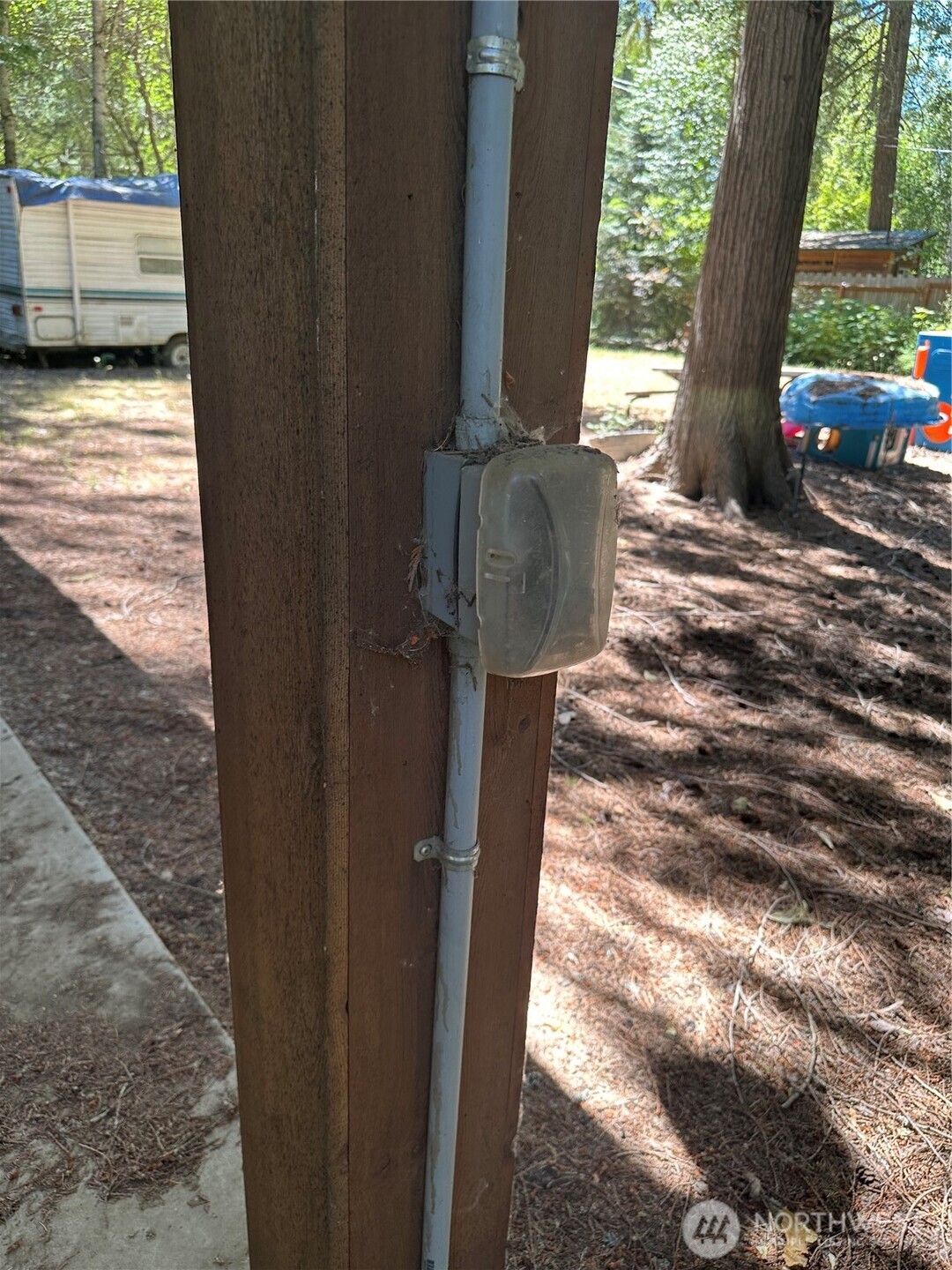 301 McElroy Road Cle Elum, WA 98922 - Photo 11 of 19 a backyard of a house with wooden floor outdoor seating and yard in backside