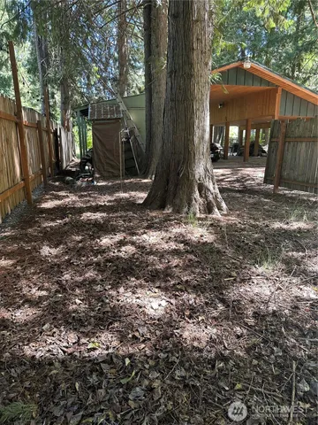 a view of a barn in the middle of a yard
