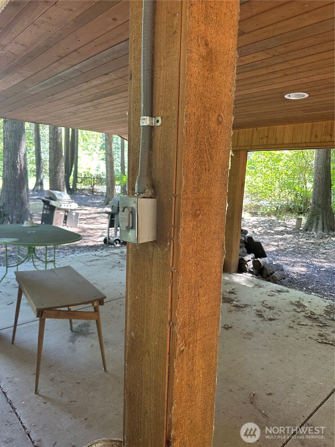 301 McElroy Road Cle Elum, WA 98922 - Photo 10 of 19 a view of a patio with table and chairs and couches with wooden floor and fence