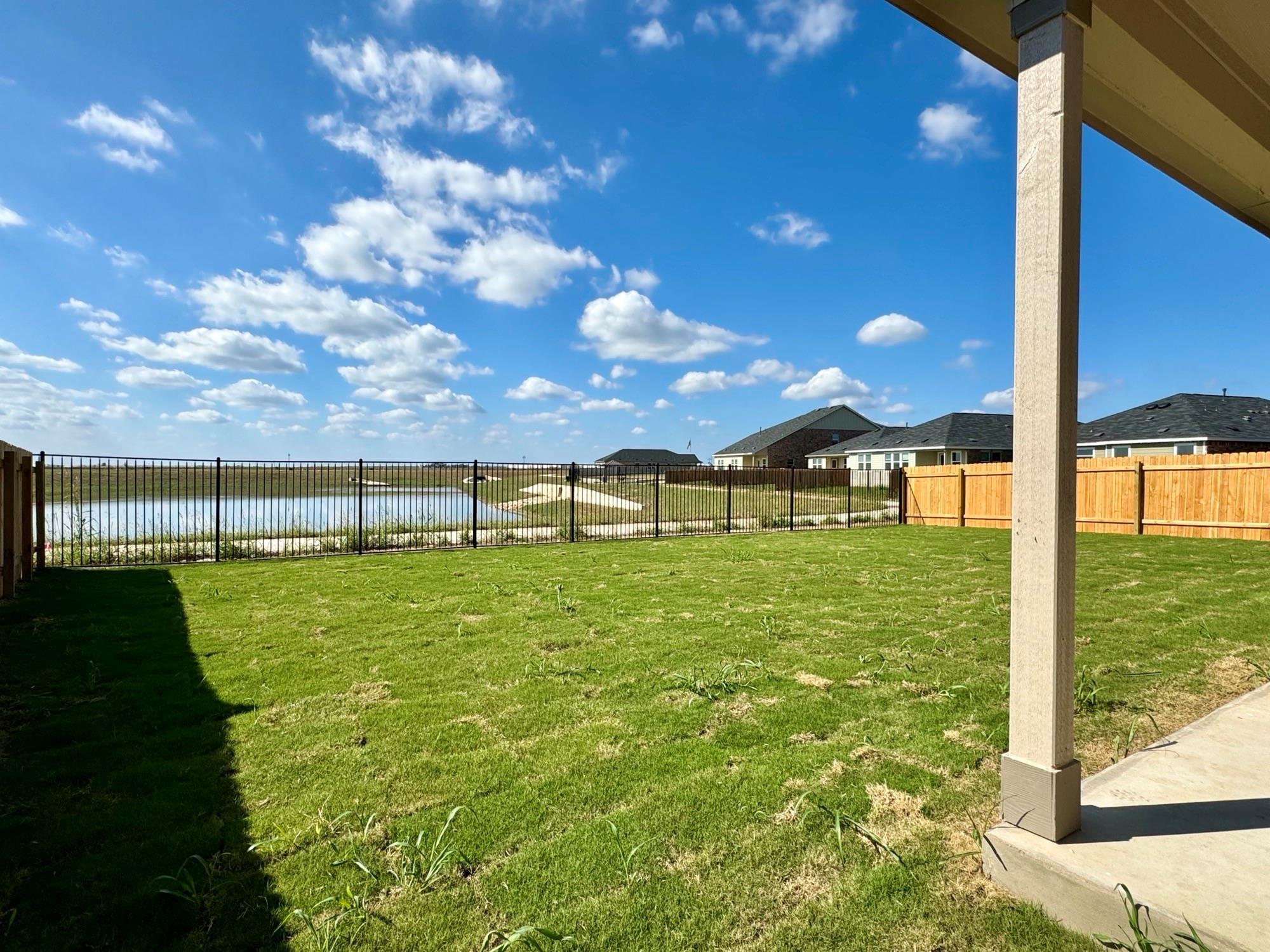 134 Agua Azul Bend Kyle, TX 78640 - Photo 7 of 10 View of yard with a patio and a water view