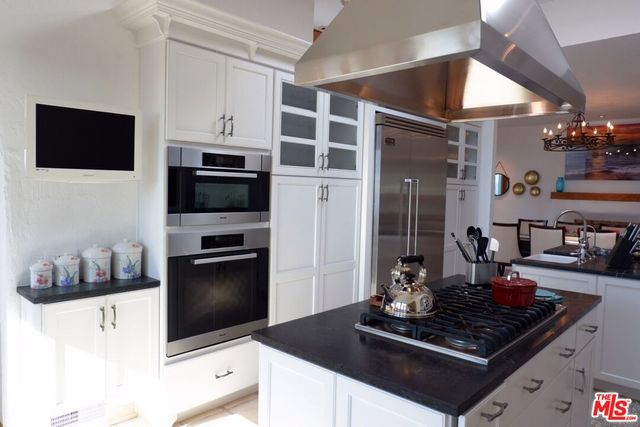 a view of a dining room with furniture and window
