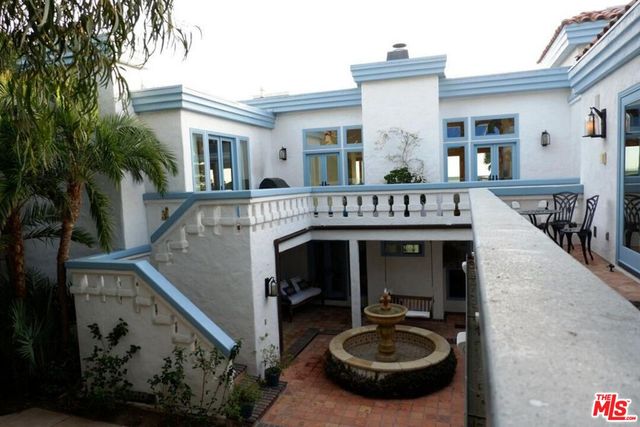 a front view of a building with garden