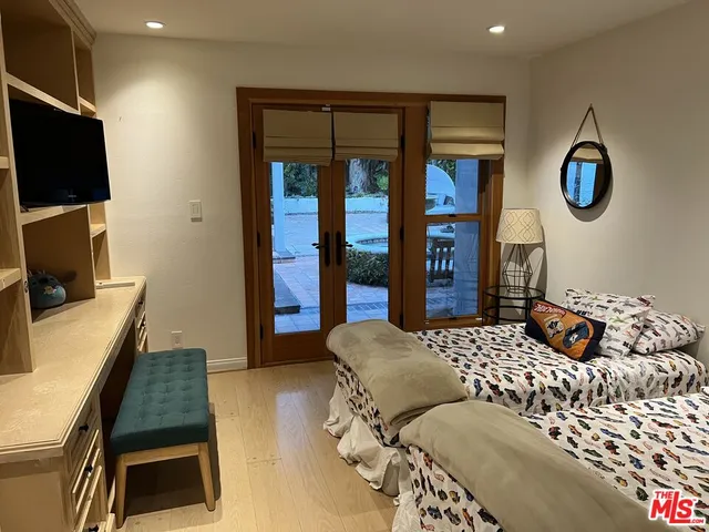 a bathroom with a shower and a sink