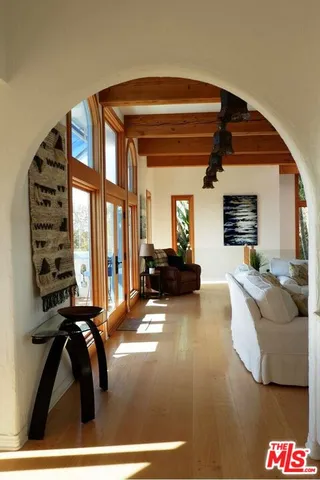 a kitchen with stove and cabinets
