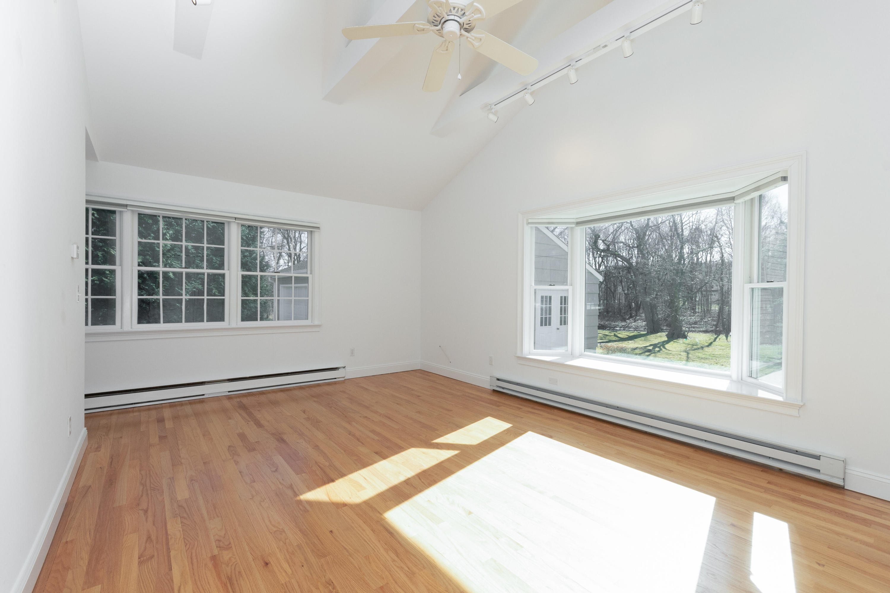 11 Cottontail Road Norwalk, CT 06854 - Photo 22 of 47 a view of an empty room with a window and wooden floor