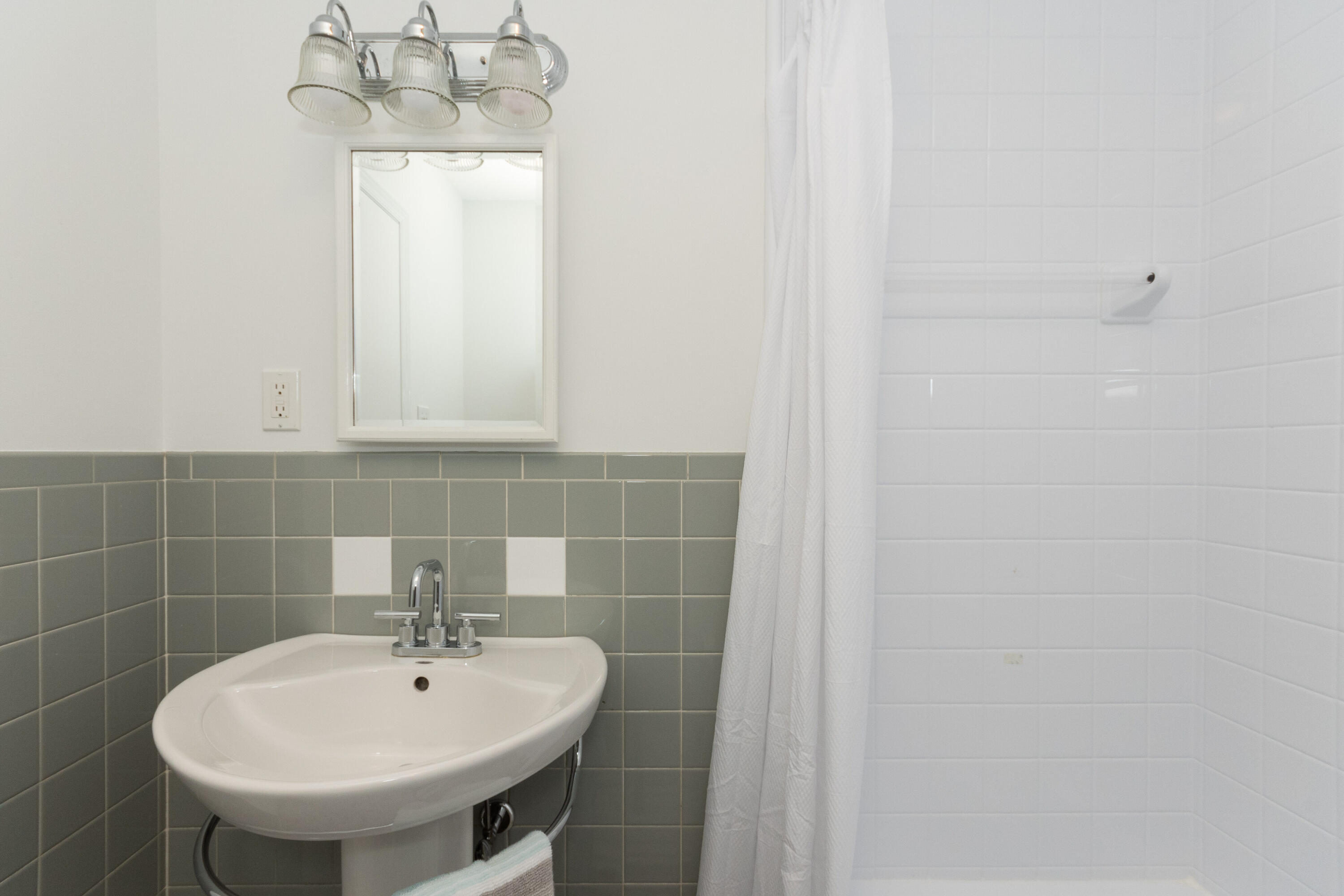 11 Cottontail Road Norwalk, CT 06854 - Photo 30 of 47 a bathroom with a sink a mirror and vanity