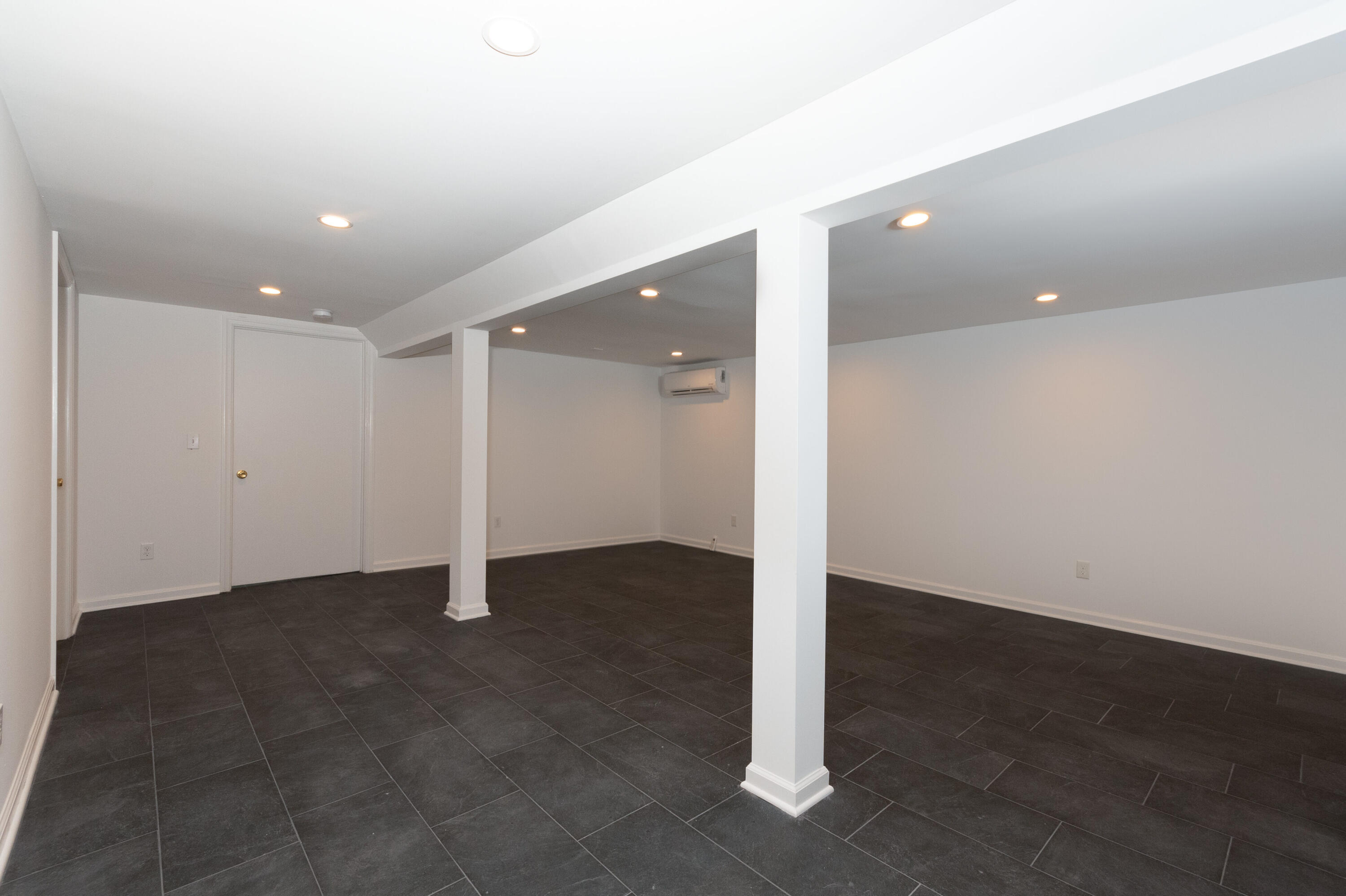 11 Cottontail Road Norwalk, CT 06854 - Photo 37 of 47 an empty room with windows and entrance to other room