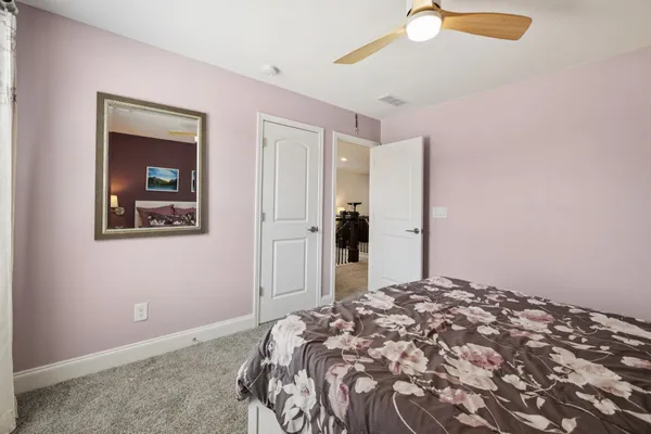 a bedroom with bed and window