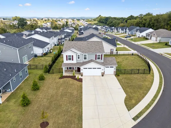 an aerial view of a house with a swimming pool