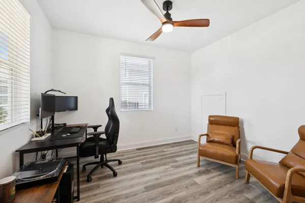 a workspace with furniture and a window