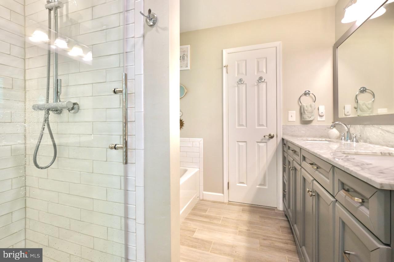 37 A Melrose Road, Unit A Princeton, NJ 08540 - Photo 15 of 25 Primary Ensuite Bathroom with Stall Shower and Tub