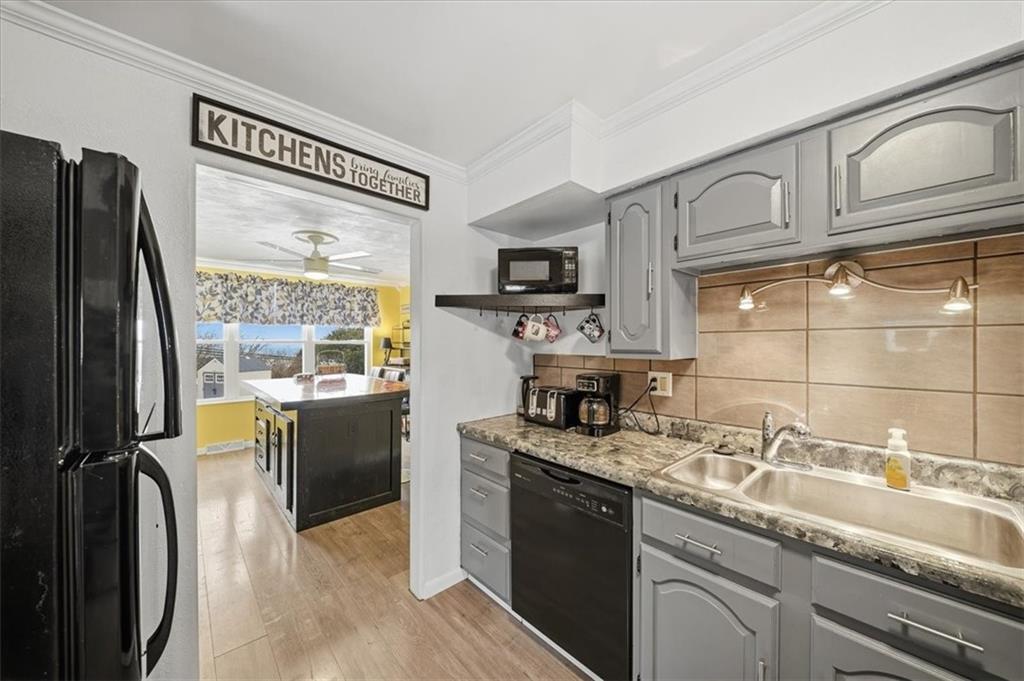 1400 Hamilton Road Pittsburgh, PA 15234 - Photo 14 of 36 a kitchen with stainless steel appliances granite countertop a sink stove and refrigerator
