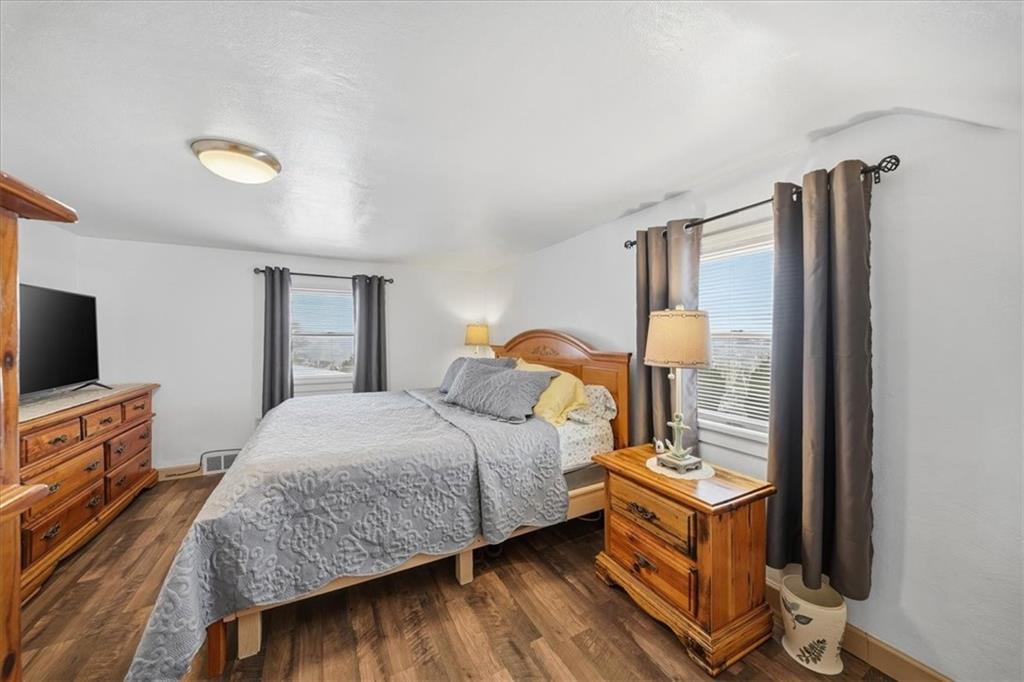 1400 Hamilton Road Pittsburgh, PA 15234 - Photo 21 of 36 a bedroom with a bed and a flat tv screen on dresser