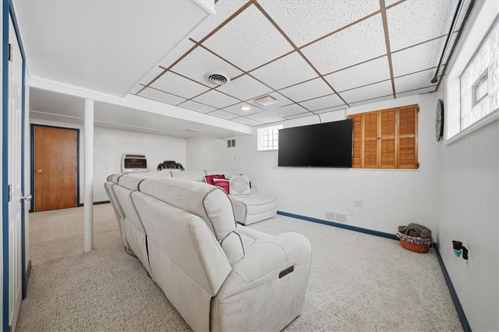 1400 Hamilton Road Pittsburgh, PA 15234 - Photo 27 of 36 a living room with furniture and a flat screen tv