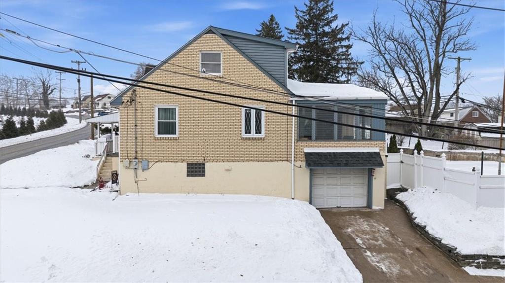 1400 Hamilton Road Pittsburgh, PA 15234 - Photo 4 of 36 a front view of a house with a garage