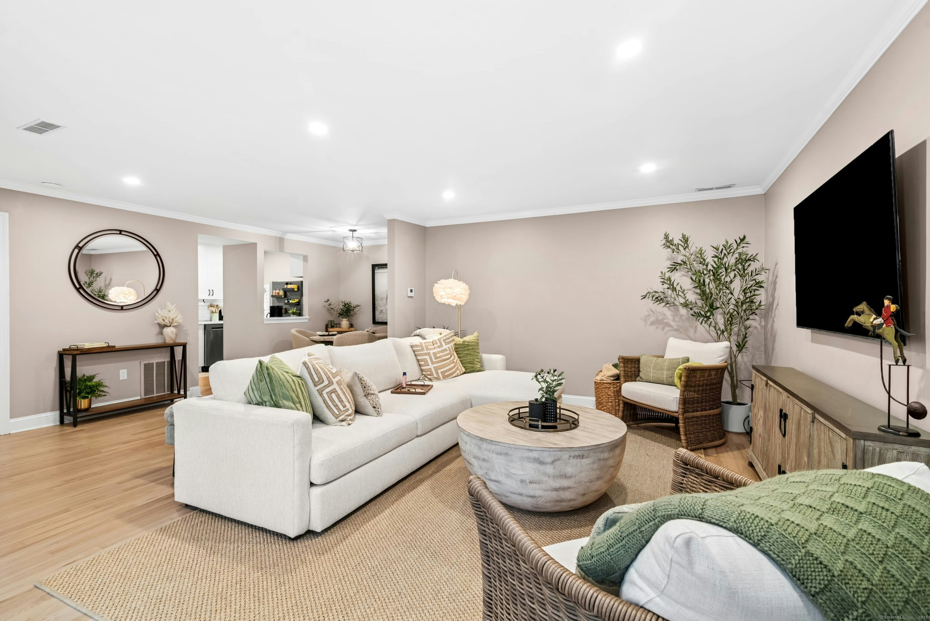 3 Nectar Lane, Unit 3 Ridgefield, CT 06877 - Photo 1 of 1 a living room with furniture a flat screen tv and a fireplace