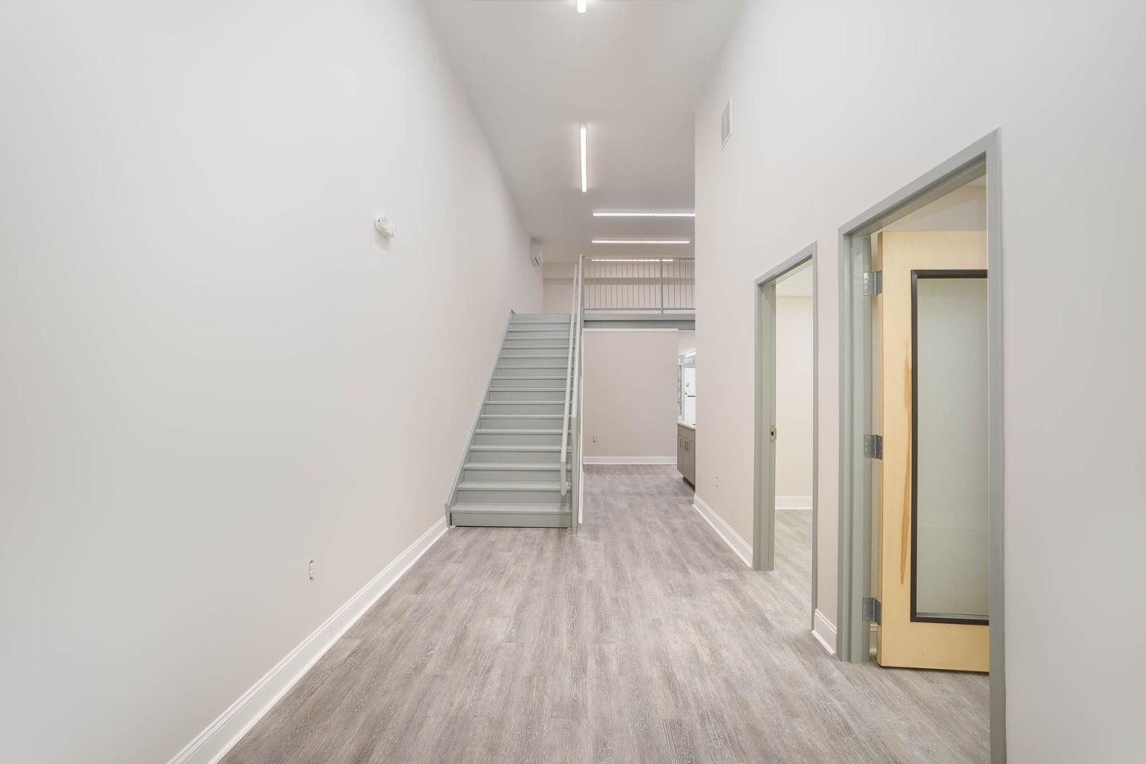 5621 Departure Drive, Unit 101 Raleigh, NC 27616 - Photo 7 of 17 a view of a hallway with wooden floor and entryway