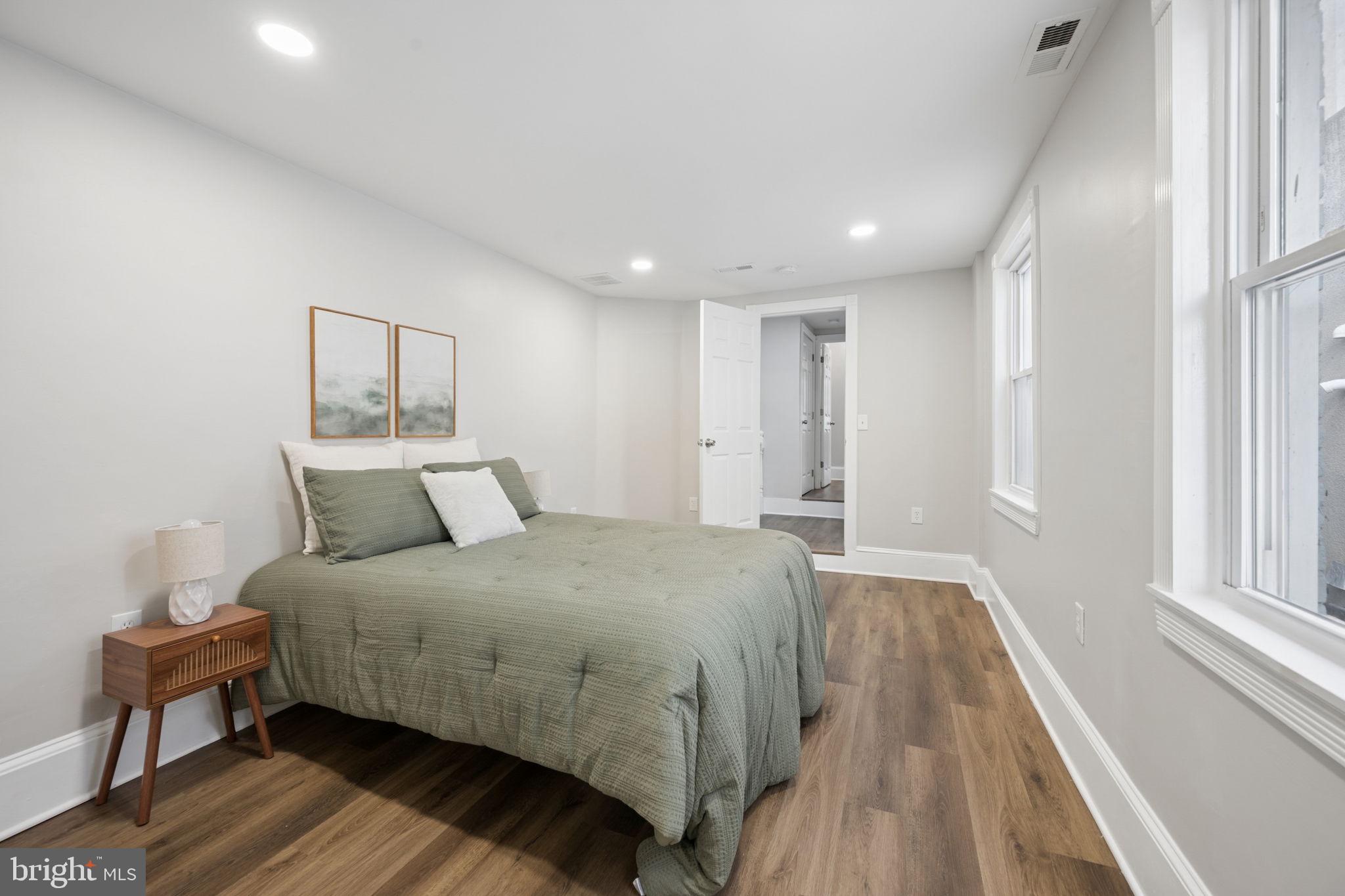 1108 South Clinton Street Baltimore, MD 21224 - Photo 36 of 66 Serene bedroom with modern charm.