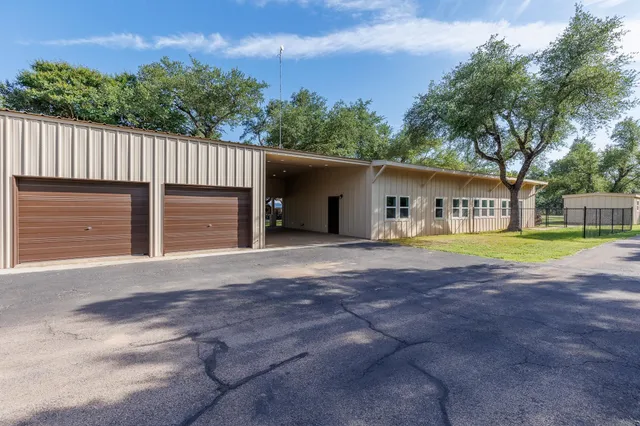 a house with trees in the background