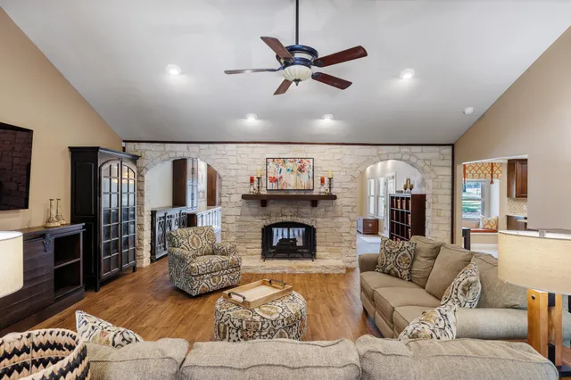 a living room with furniture and a fireplace