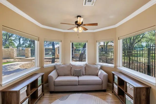 a living room with furniture and a large window
