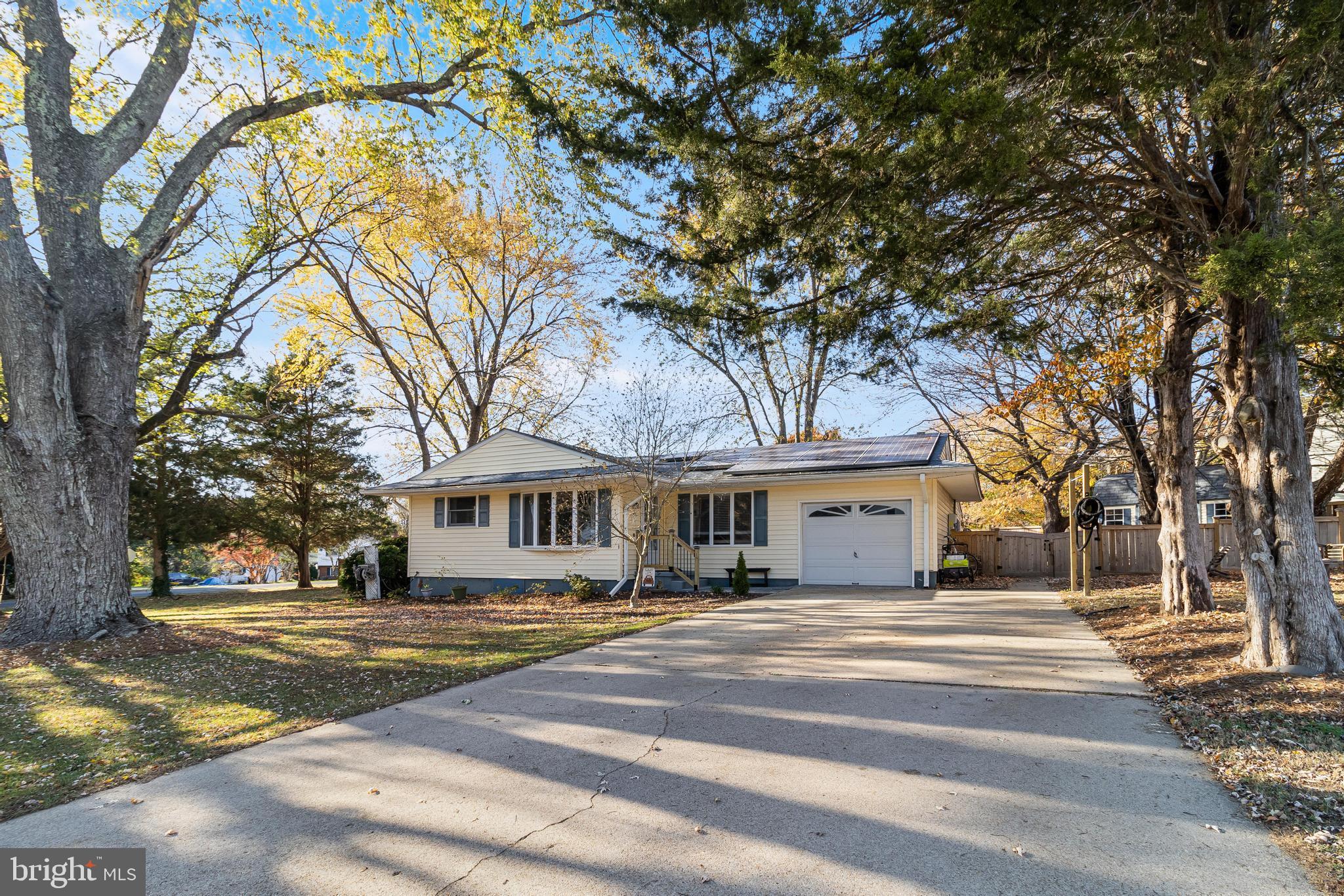 40905 Spring House Lane Leonardtown, MD 20650 - Photo 1 of 50 a front view of a house with a yard