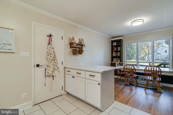 a view of a livingroom with furniture and hardwood floor